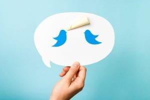 Two Twitter birds in a speech bubble