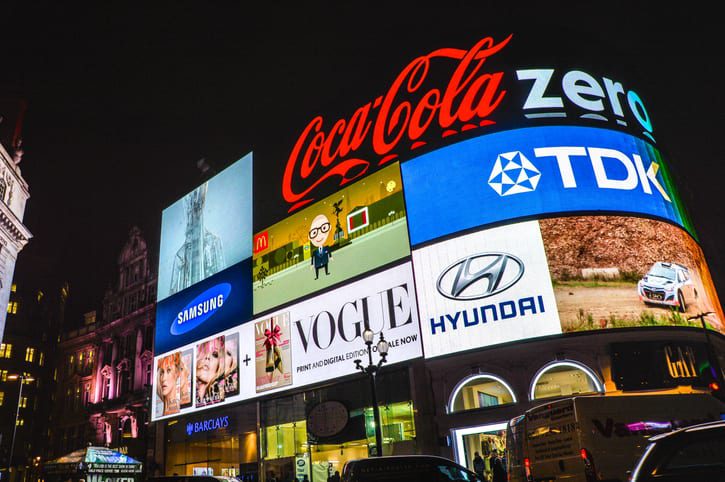 A digital billboard with brand logos.