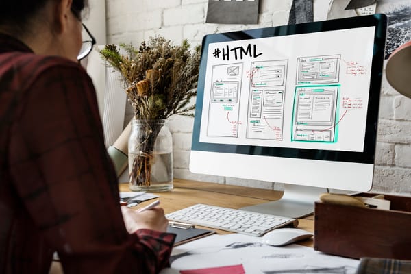 One of the web designers near me working on HTML.